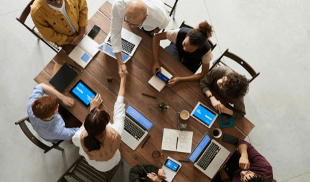 Top view of people sitting and working